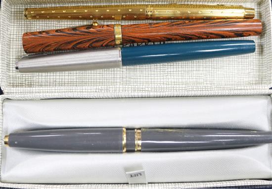 Three Parker pens and Waterman pen